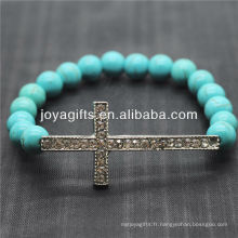 Bracelet en pierres précieuses élastique en perles rondes turquoise de 8 mm avec Diamante Cross au milieu